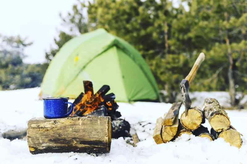 Winter camping with a tent doesn't have to be cold at all with the right preparation